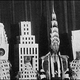 Illustration for article titled Crown or Dunce Cap? Starchitects Wear Their Famous Buildings As Hats